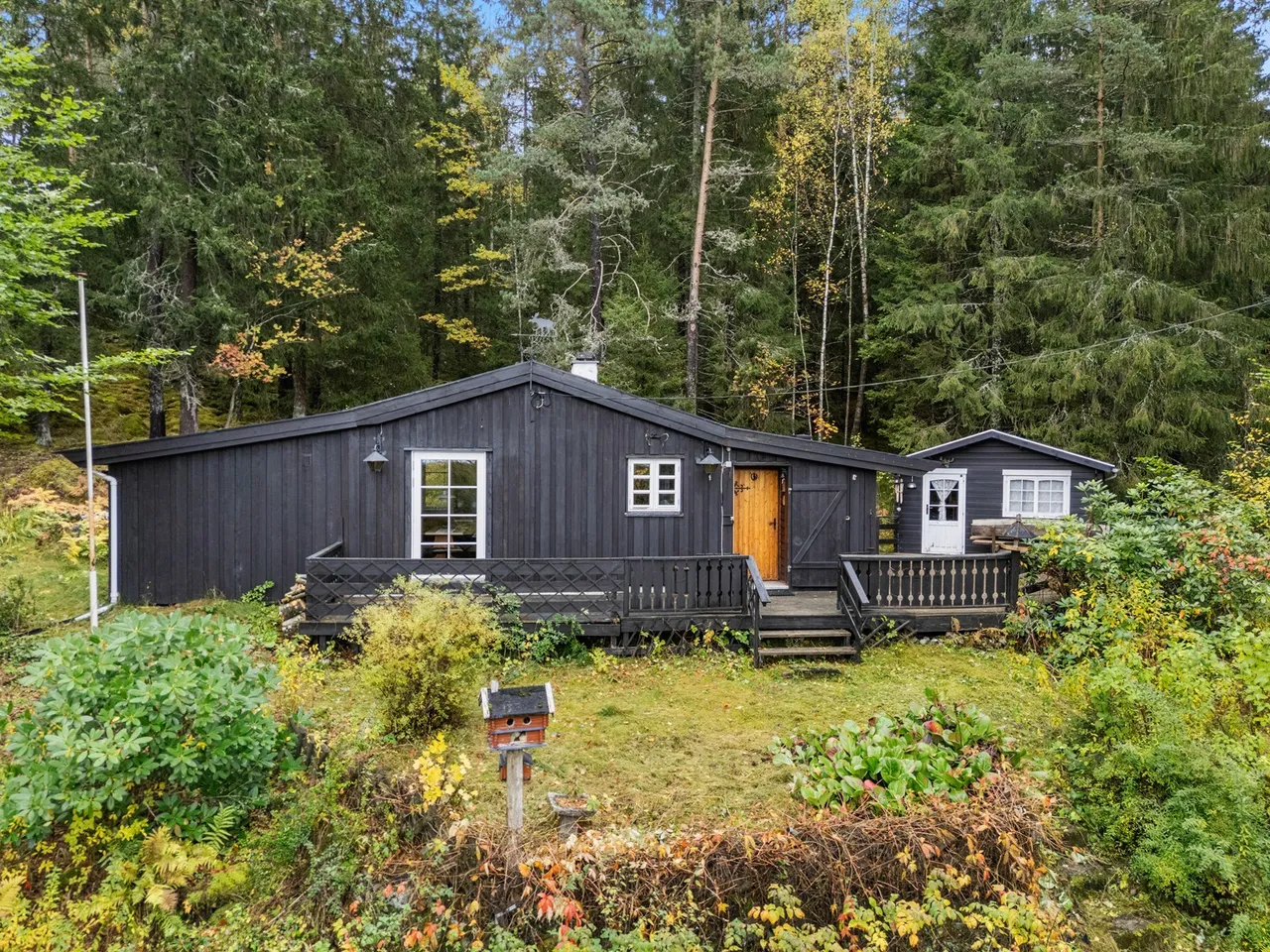 Grey marble bathroom with round mirror and floating sink